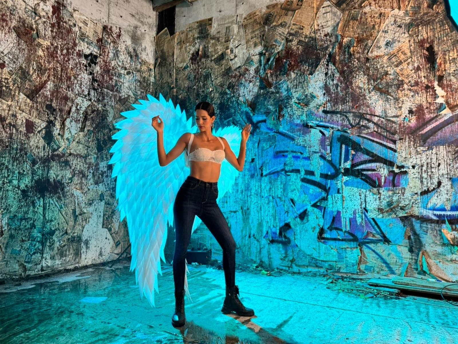 A CGShift fashion shoot lit in cyan against a graffiti wall